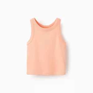 Top acanalado coral para niña, en algodón elástico, con etiqueta interior estampada para mayor comodidad.