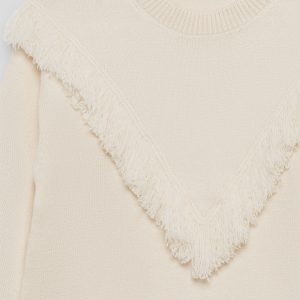 Jersey de punto beige con flecos para niña